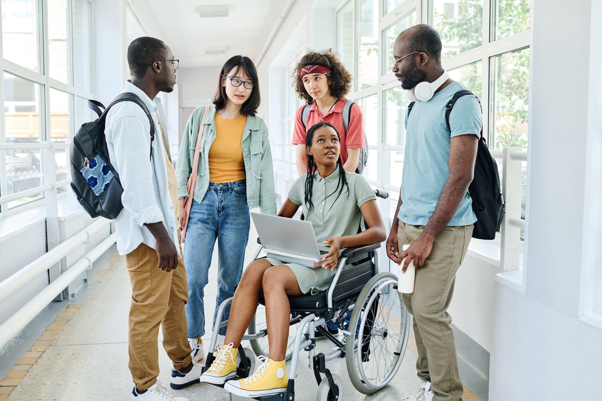 Group of students using laptop at break