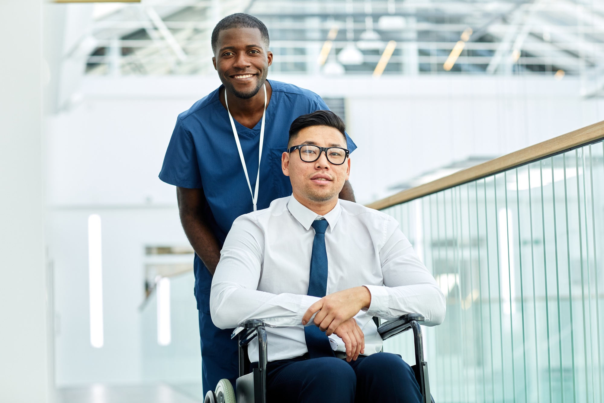 Male Nurse Helping Person with Disability