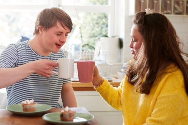 SIL services supporting adults sharing coffee at home